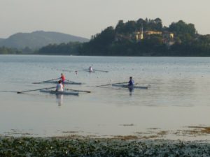 Sculling by a castle, Lago Varese, Italy